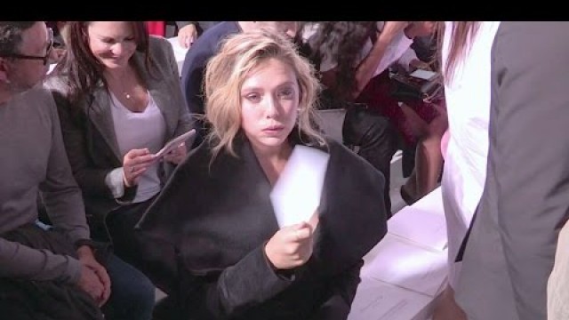 'Camera Shy Elizabeth Olsen attending the Dior Fashion Show in Paris'